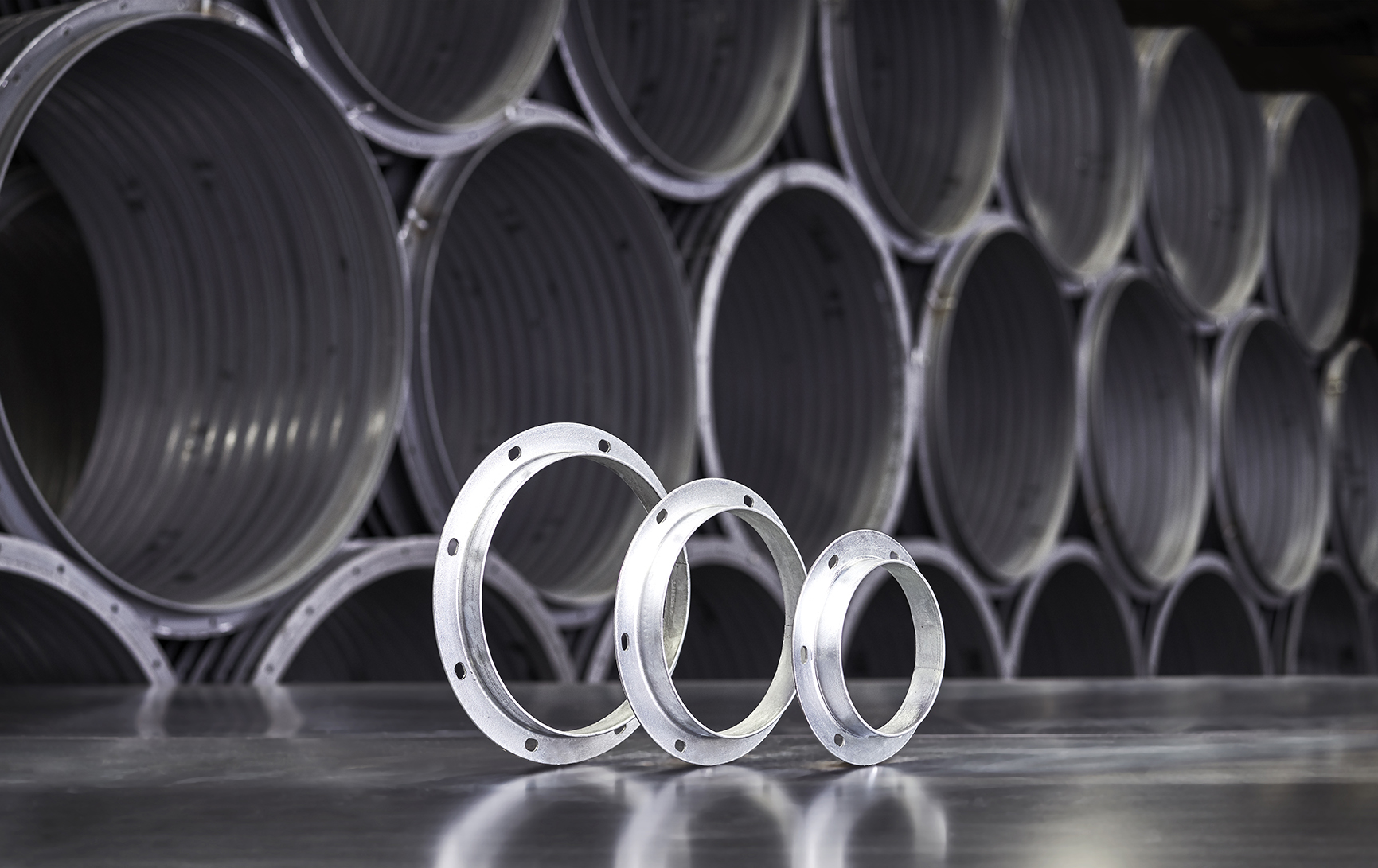 Stock, punched galvanized angle rings with slotted holes
